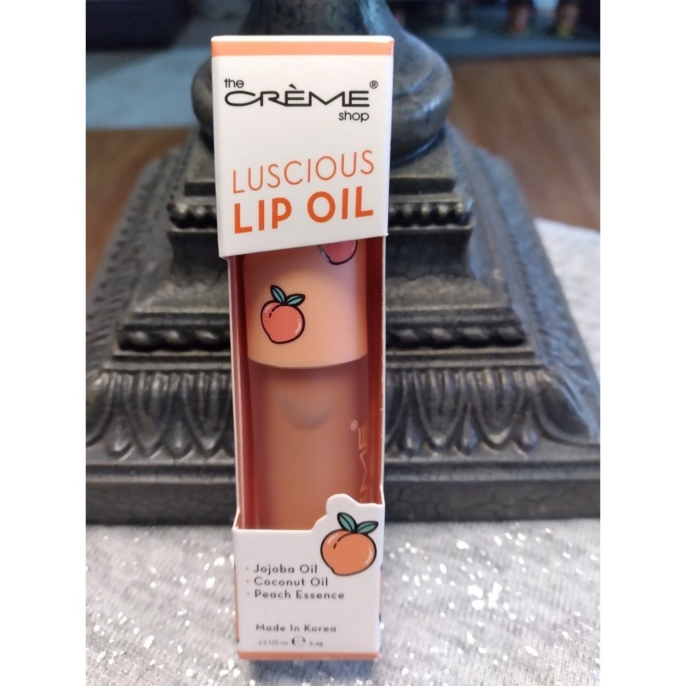 The Creme Shop Luscious Lip Oil Peach Essense Jojoba Oil Coconut Oil .12 OZ/3.4g
